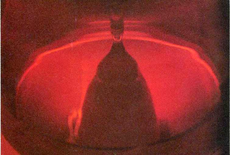 This photograph of a crystal being grown was taken at CSI around 1982